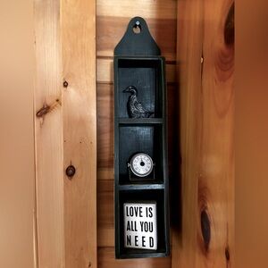 Dark green primitives shelf